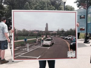 Protected bike lane poster from July 3rd press conference