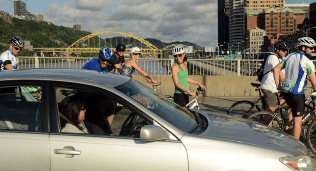 PedalPGH Riders talking with driver