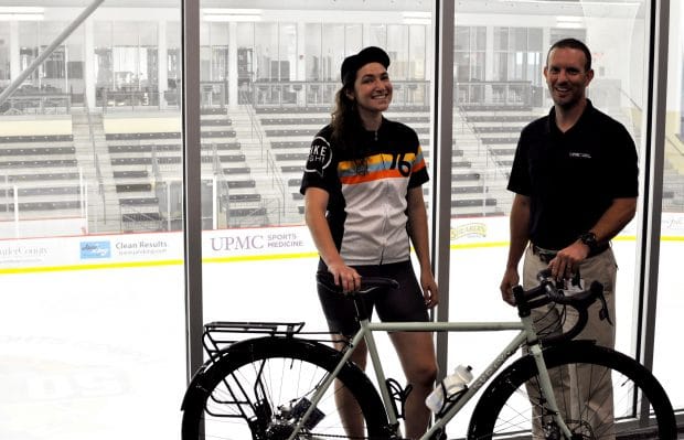 Julie and Matt stand in front of The UPMC Lemieux Sports Complex Official Penguins Practice Rink Left: Julie Mallis, Education Program Manager, Bike Pittsburgh, Right: Matthew L Tinkey MS, LAT, ATC, PES, UPMC Sports Medicine