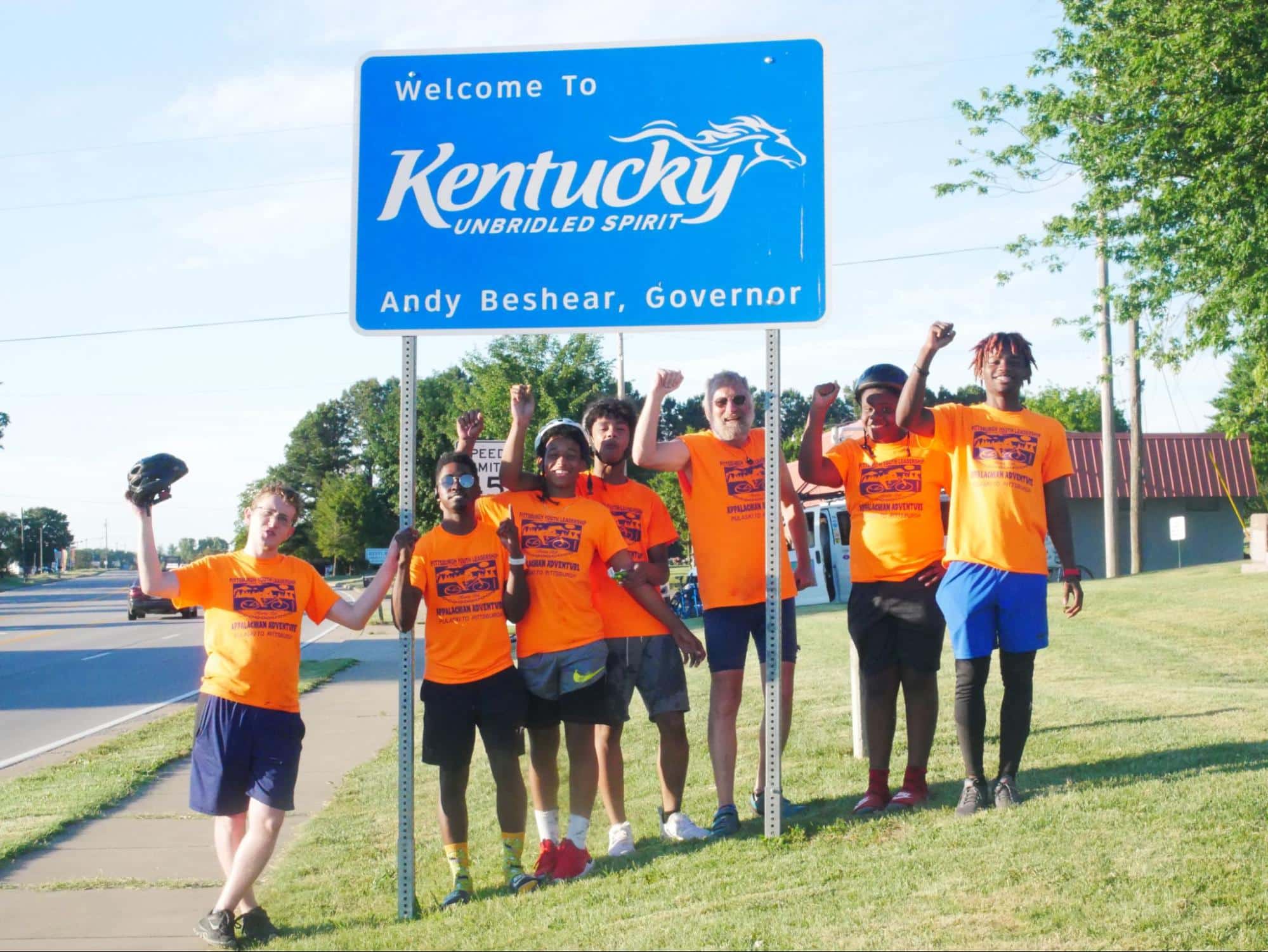 PYL participants in front of a Welcome to Kentucky sign