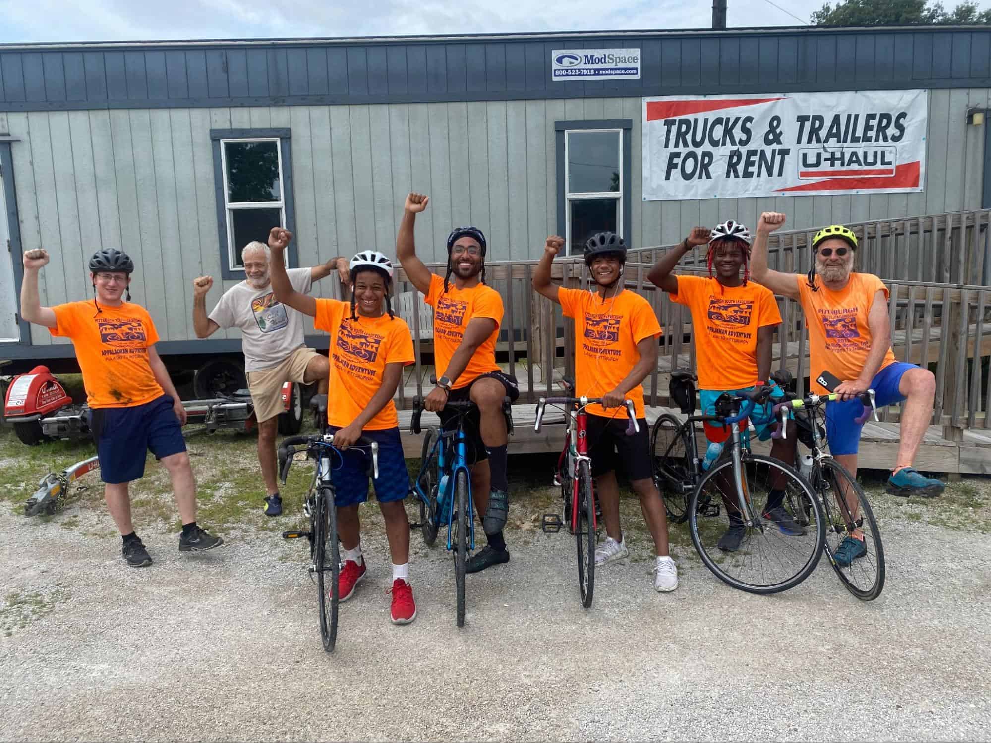 PYL participants in front of a a u haul trailer