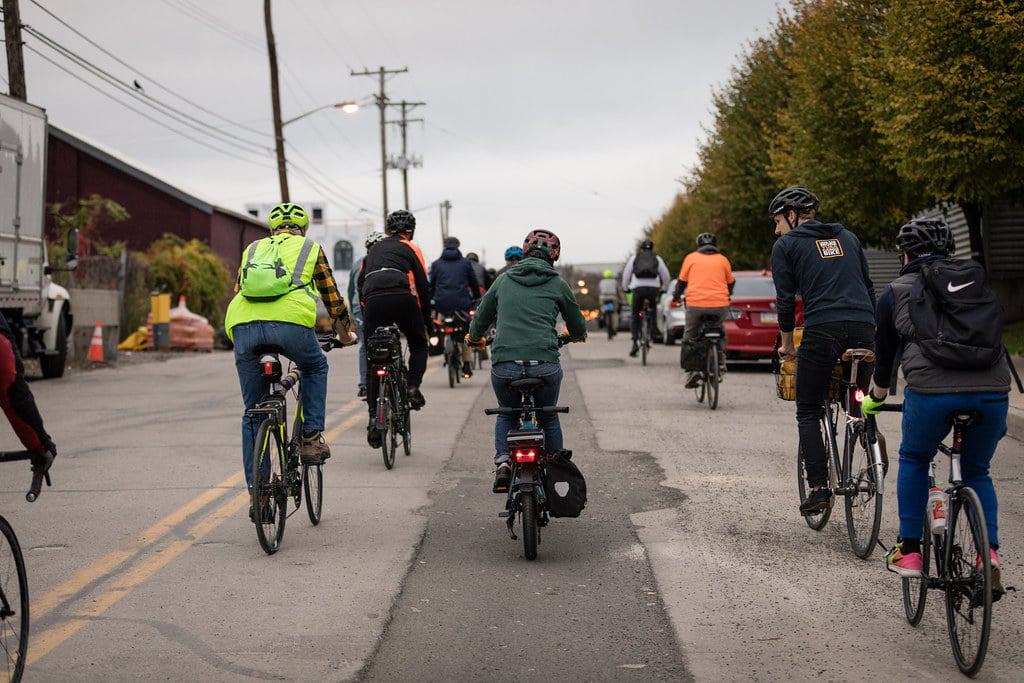 A group of people riding bicycles together