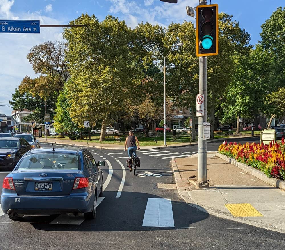 A picture of a bicyclist riding in the new bike lanes between Baum and Centre