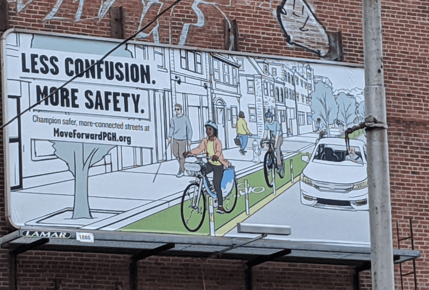 Image of the ad campaign on a billboard showing an illustration of people riding in a protected bike lane