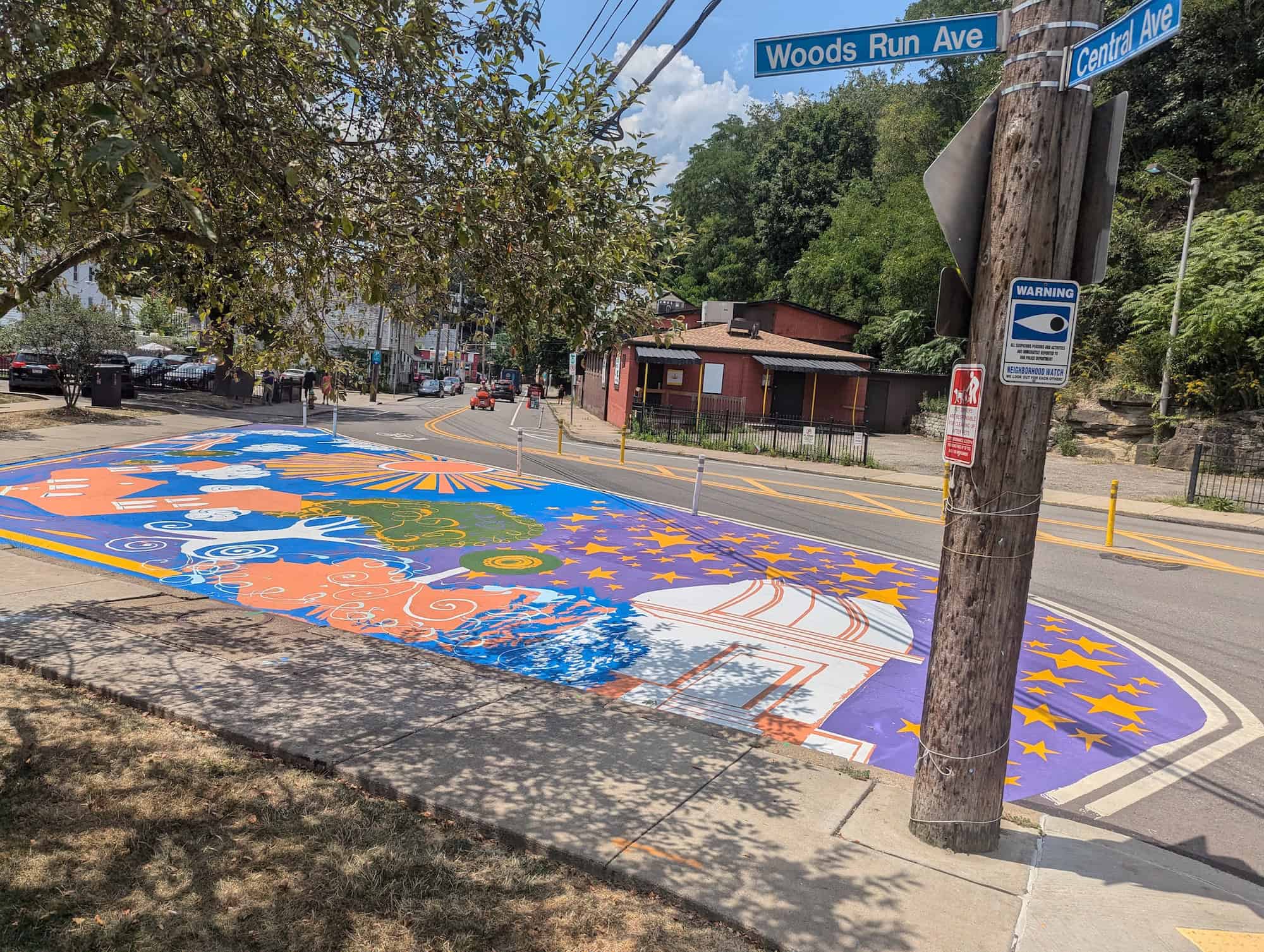 Image of the asphalt street mural at Woods Run Ave and Central Ave