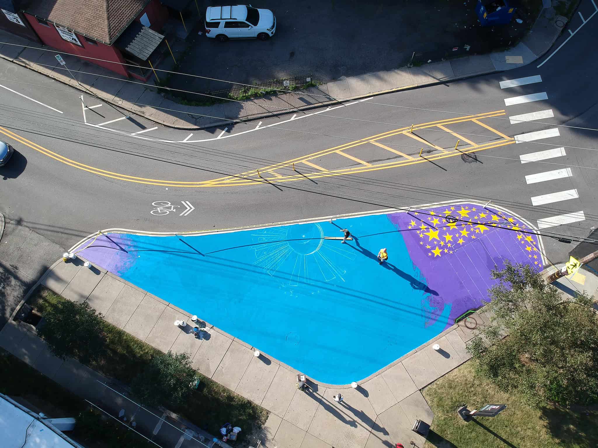 A drone shot of the mural in progress