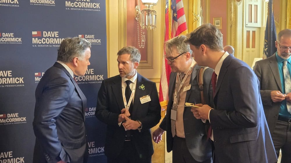 BikePGH Executive Director Scott Bricker at the National Bike Summit discussing federal multimodal transportation funding with Senator Dave McCormick.