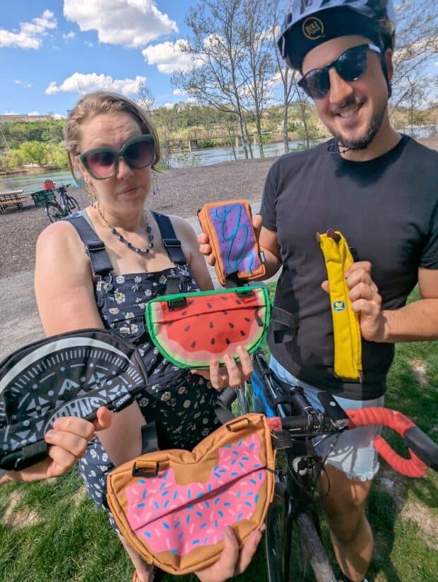 SNACK branded bike bags shaped like a watermelon, oreo, donut, pop tart, and banana