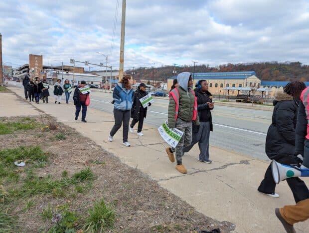 People walking down a sidewalk.