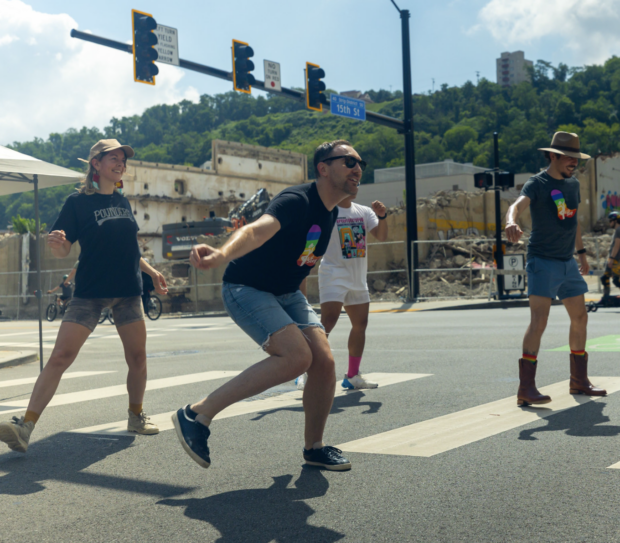 4 people from 412-Step, dancing on an open road