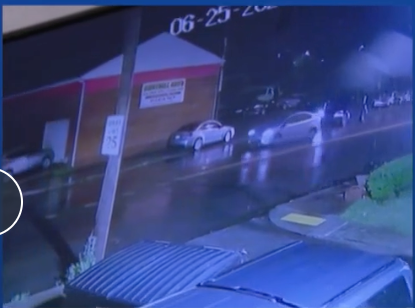 Still frame from WTAE news video showing cars parked on the sidewalk along Bennett Street near where the crash occurred.