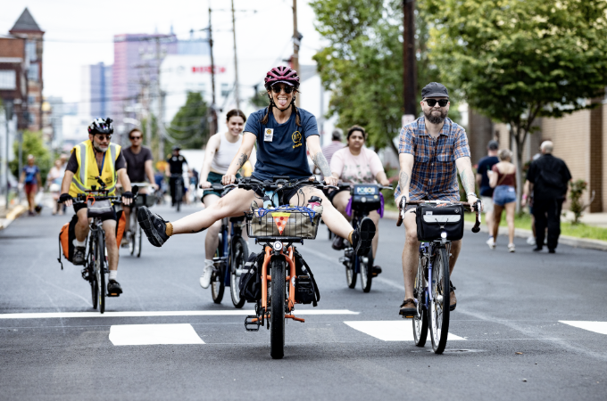 A handful of joyful bike riders exploring the course