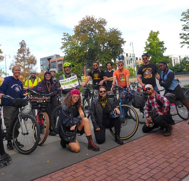 Group photo of the "biker crew" in their biker costumes with bandanas, fake tattoos, and chains. 