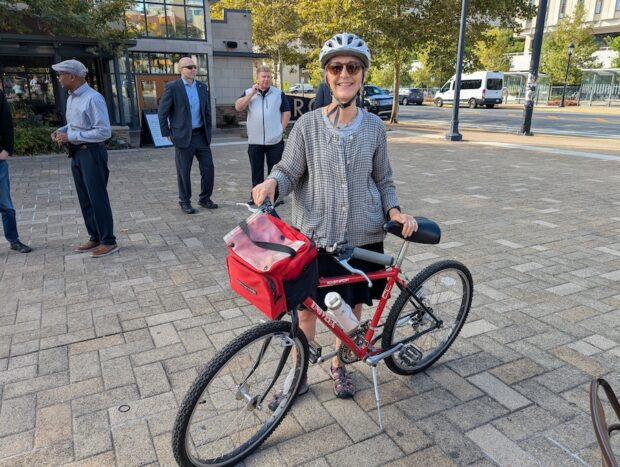 Dr. Debra L. Bogen, Secretary of Health, Pennsylvania Department of Public Health, poses with her red bicycle.